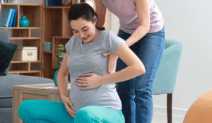 Doula helping pregnant woman