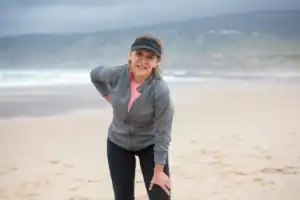 Woman holding sore knee